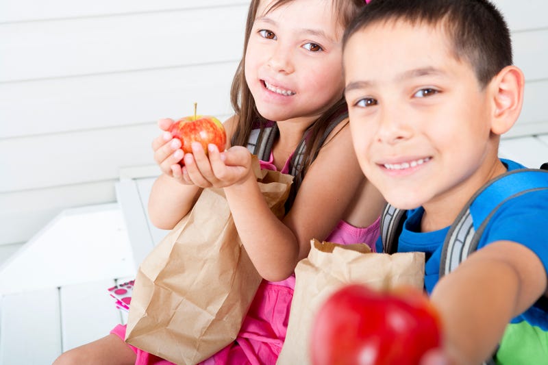 Kids with brown bag lunch