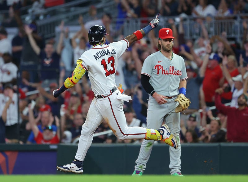 Ronald Acuna Jr. #13 of the Atlanta Braves reacts as he rounds first base after hitting his 39th home run of the season to lead off the sixth inning against the Philadelphia Phillies