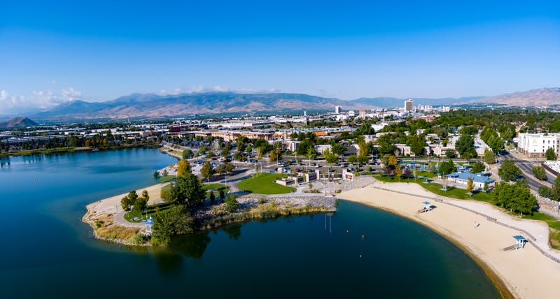 Aerial view of the Sparks Marina Park, Reno and Sparks cityscape with Mt. Rose, Slide Mountain in the background during early autumn.
