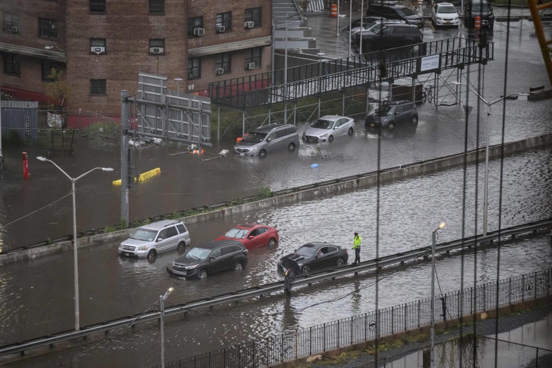 A general view shows cars stranded in floodwater on the FDR Drive in Manhattan on September 29, 2023