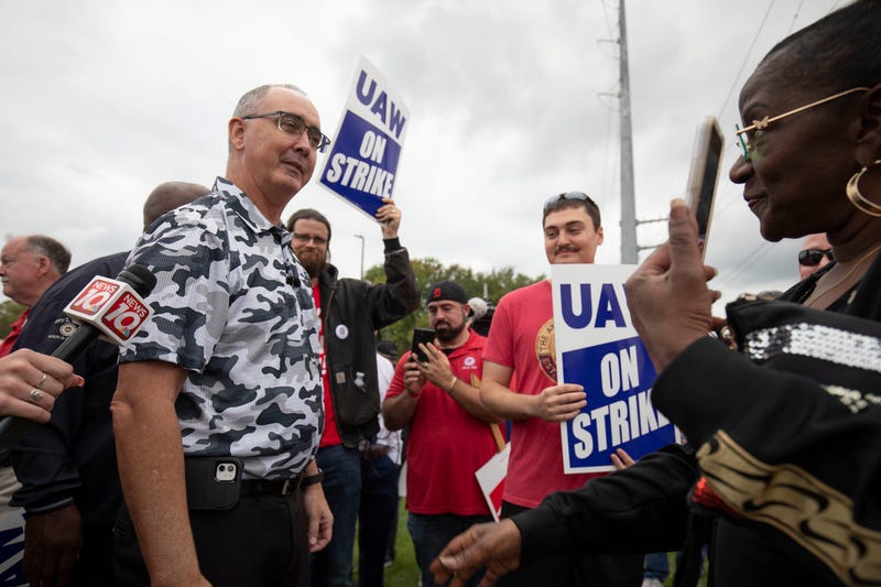 UAW President Shawn Fain greets union workers