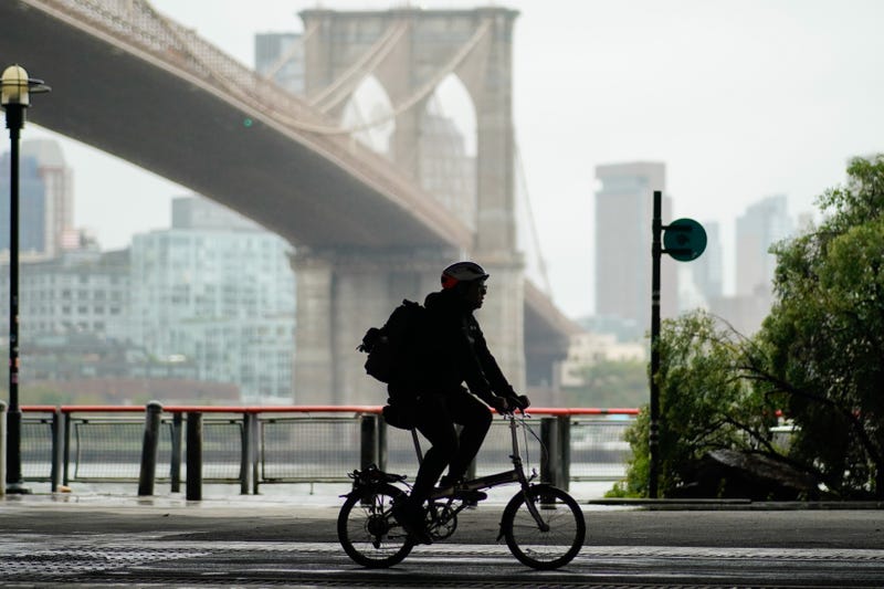 A man rides his bicycle during a coastal storm in Lower Manhattan in New York City.