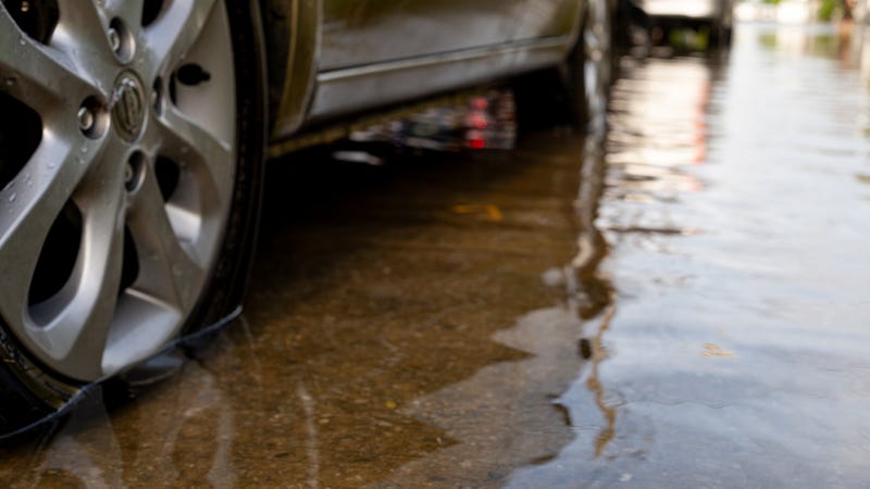 Car parked on flood rood after raining all night