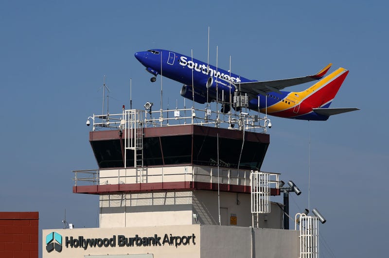 A Southwest Airlines take off past the control tower at Burbank Hollywood Airport on September 25, 2023 in Burbank, California. Transportation Secretary Pete Buttigieg is warning that vital training for new air traffic controllers would be paused if the government shuts down later this week. The Department of Transportation currently has 2,600 much needed air traffic controllers undergoing training and employs 1,200 fewer certified controllers than that agency did 10 years ago. (Photo by Justin Sullivan/Getty Images)