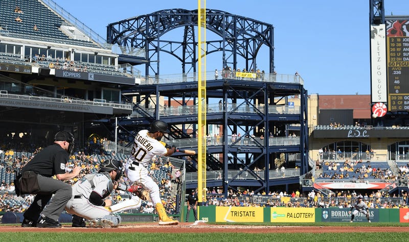 Liover Peguero #60 of the Pittsburgh Pirates hits a triple