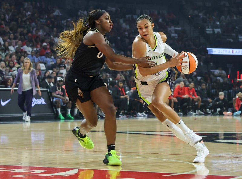 Satou Sabally #0 of the Dallas Wings drives against Jackie Young #0 of the Las Vegas Aces in the first quarter of Game Two of the 2023 WNBA Playoffs semifinals at Michelob ULTRA Arena on September 26, 2023 in Las Vegas, Nevada.