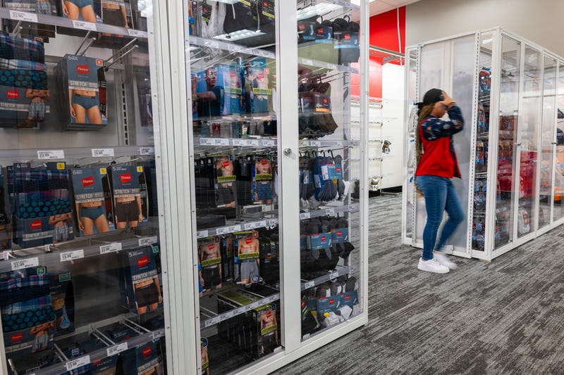 Products sit behind plexiglass at a Target store in Harlem on September 28, 2023.