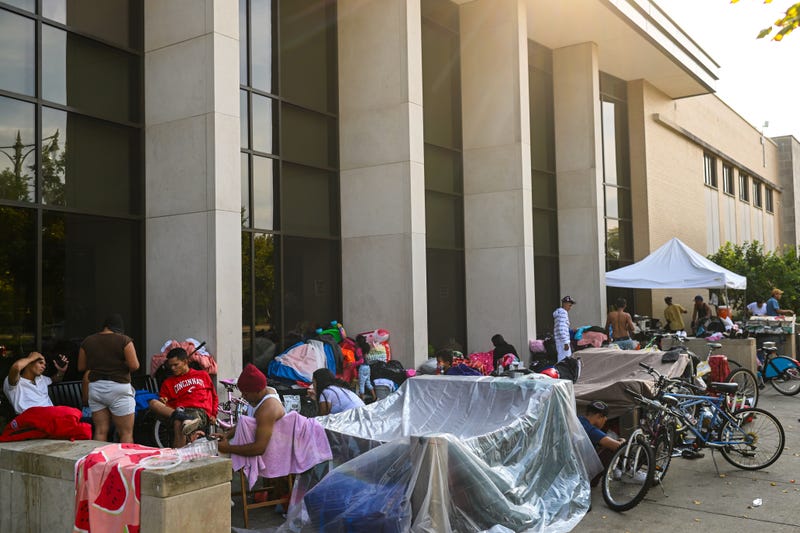 Migrants living at the Chicago Police Department