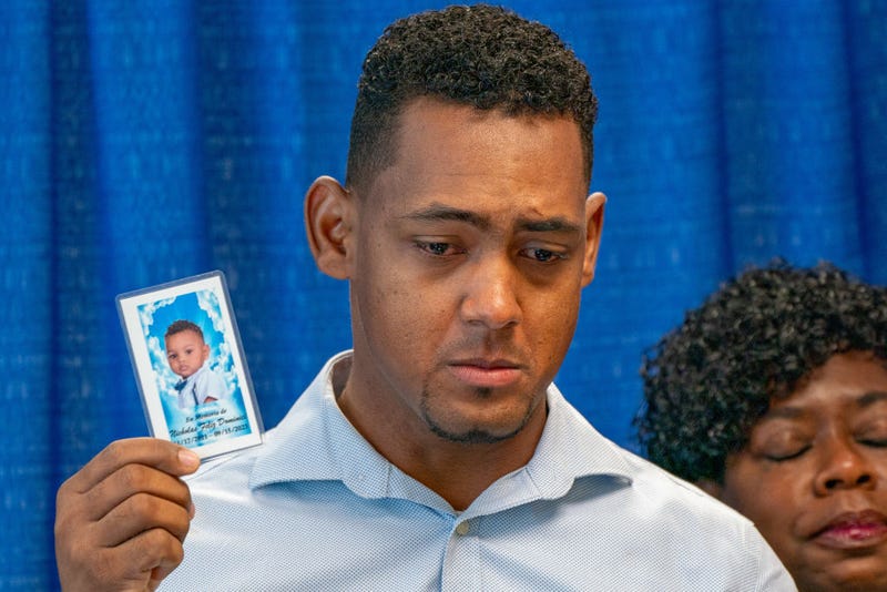 Parents of deceased 1-year-old boy Nicholas Dominici and family members of the other sickened toddlers held a press conference with Bronx District Attorney Darcel Clark on Oct. 5, 2023.