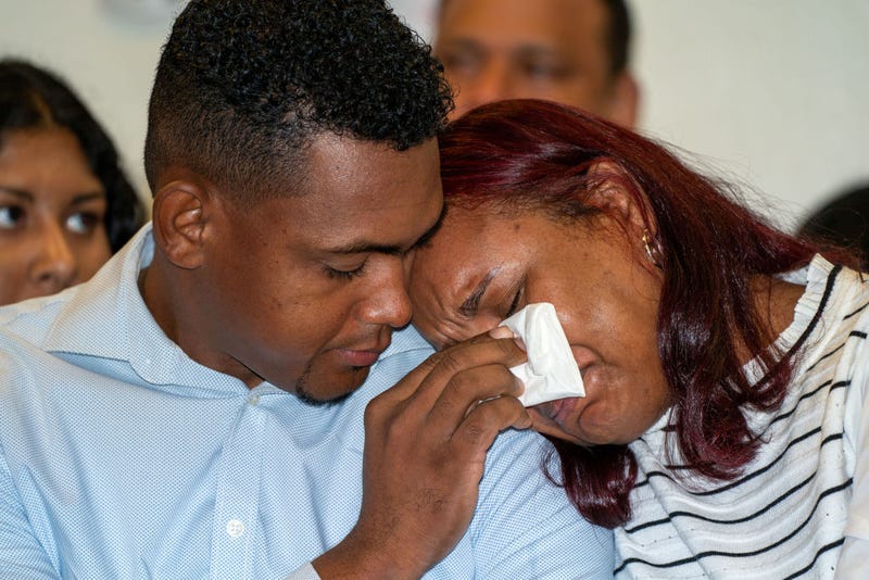 Otoniel Feliz and Zoila Dominici, parents of deceased Nicholas Dominici, are seen here at Press Conference with Bronx District Attorney Darcel Clark on Oct. 5, 2023. 