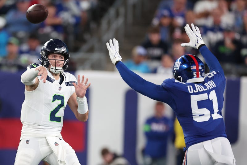 EAST RUTHERFORD, NEW JERSEY - OCTOBER 02: Drew Lock #2 of the Seattle Seahawks throws the ball against Azeez Ojulari #51 of the New York Giants during the second quarter at MetLife Stadium on October 02, 2023