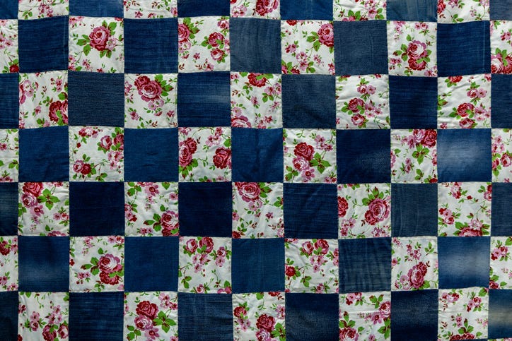 Handmade Patchwork Quilt Background With Colorful Rustic Ethnic Geometric Pattern. Vintage Scrappy Quilting Texture.