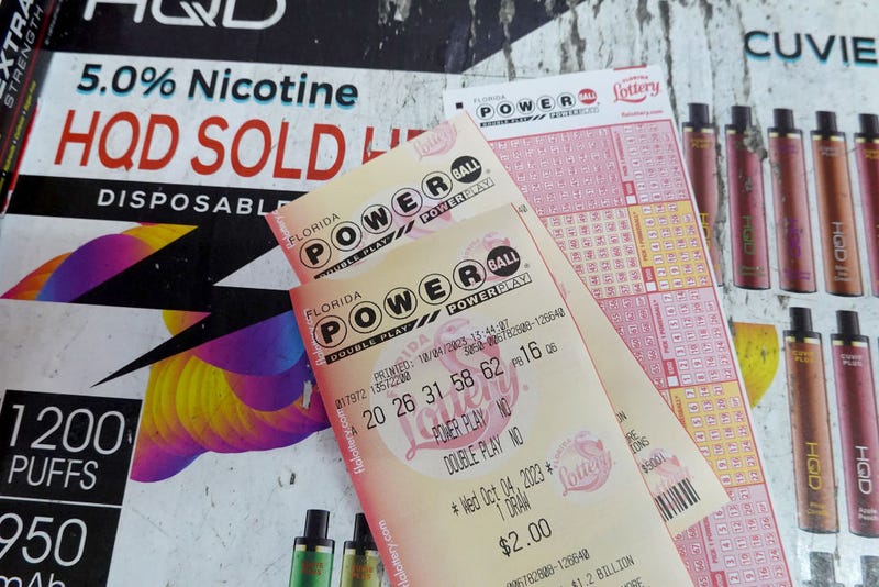 Powerball tickets are seen on a counter after being purchased in a store on October 04, 2023 in Miami, Florida. 