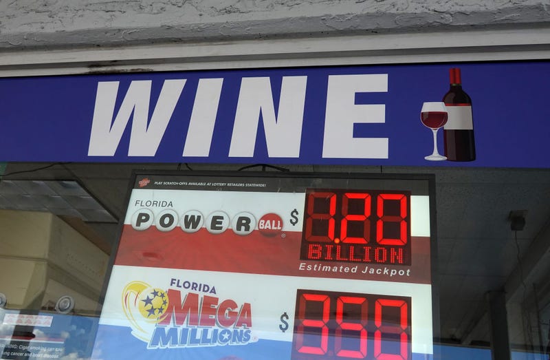 A sign shows the estimated jackpot for Powerball in the window of a store on October 04, 2023 in Miami, Florida. Wednesday's Powerball drawing will be an approximately $1.2 billion jackpot. 