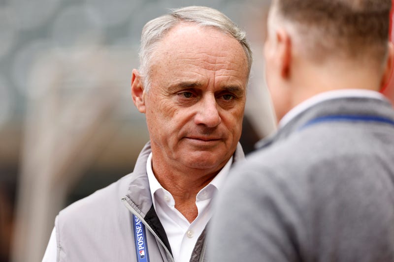Major League Baseball Commissioner Robert D. Manfred Jr. talks prior to Game Two of the Wild Card Series between the Toronto Blue Jays and the Minnesota Twins at Target Field on October 04, 2023 in Minneapolis, Minnesota.