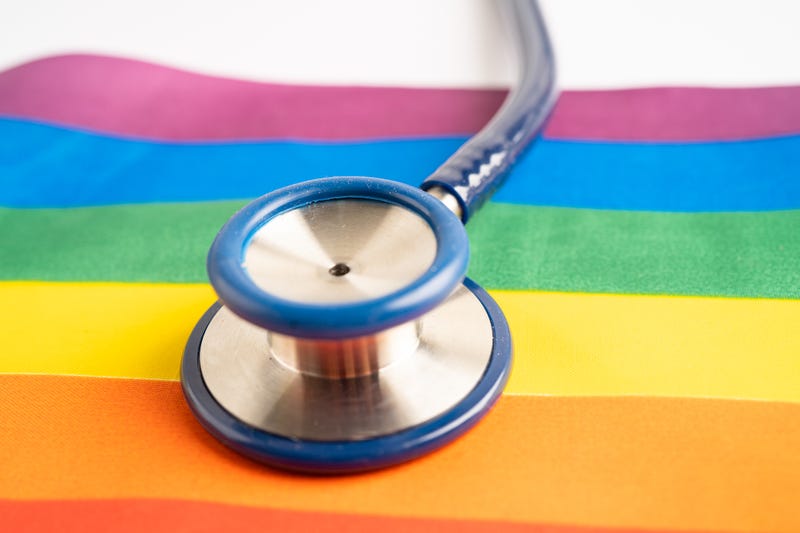 Pride flag and stethoscope.