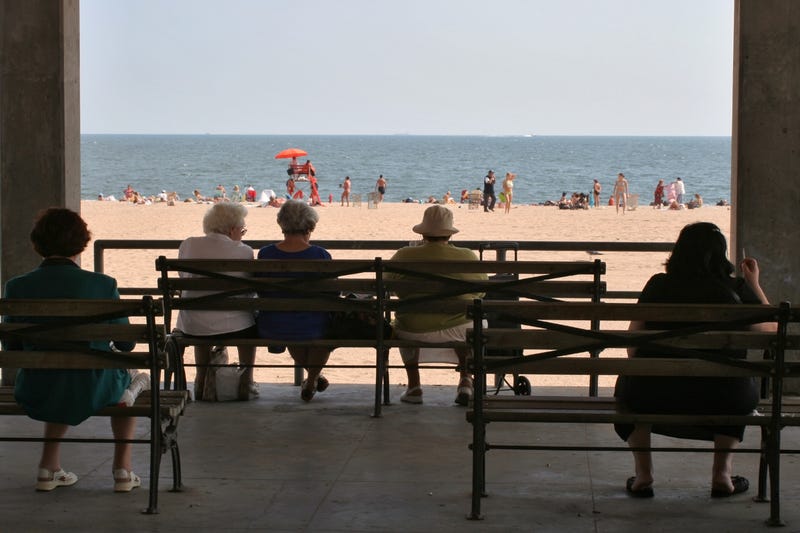 People take in a summer day at Brighton Beach
