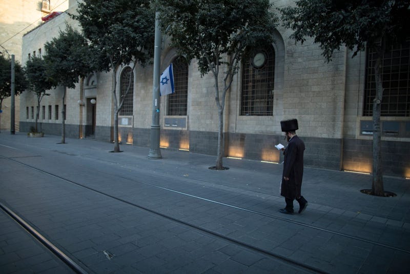 A jewish man walks in Jerusalem's Jaffa street on October 13, 2023 in Jerusalem, Israel. Israel has sealed off Gaza and launched sustained retaliatory air strikes, which have killed at least 1,200 people with more than 300, 000 displaced, after a large-scale attack by Hamas. On October 7, the Palestinian militant group Hamas launched a surprise attack on Israel from Gaza by land, sea, and air, killing over 1,200 people and wounding around 2800. Israeli soldiers and civilians have also been taken hostage by Hamas and moved into Gaza. The attack prompted a declaration of war by Israeli Prime Minister Benjamin Netanyahu and the announcement of an emergency wartime government. (Photo by Amir Levy/Getty Images)