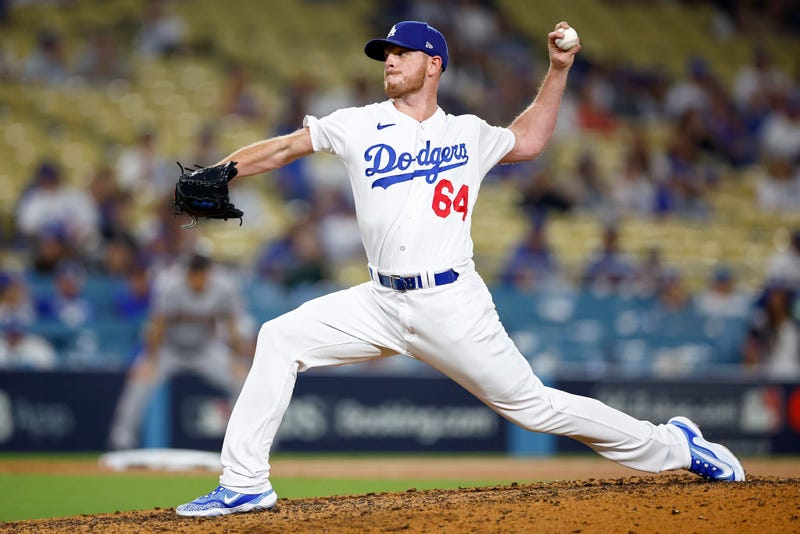 Caleb Ferguson #64 of the Los Angeles Dodgers pitches in the ninth inning against the Arizona Diamondbacks during Game One of the Division Series at Dodger Stadium on October 07, 2023 in Los Angeles, California.