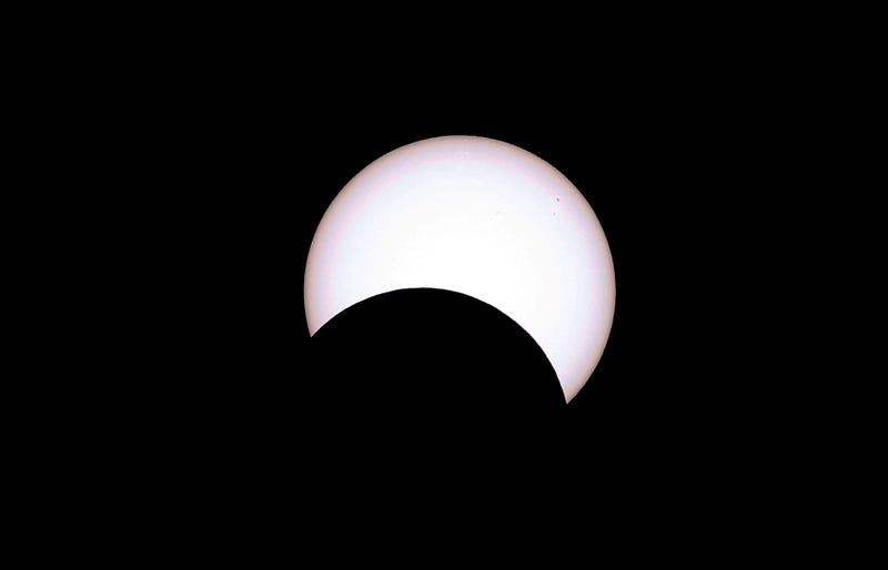 The moon crosses the sun as it exits the maximum eclipse during the Annular Solar Eclipse on October 14, 2023 in Capitol Reef National Park