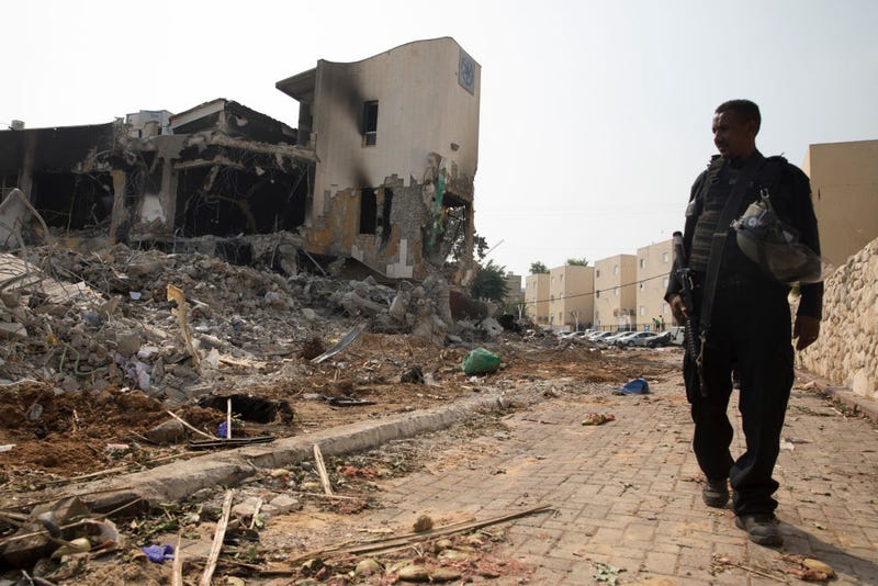Police Officer walks near a police station that was destroyed after a battle between Israeli troops and Hamas militants that have take the station on October 8, 2023 in Sderot, Israel. 