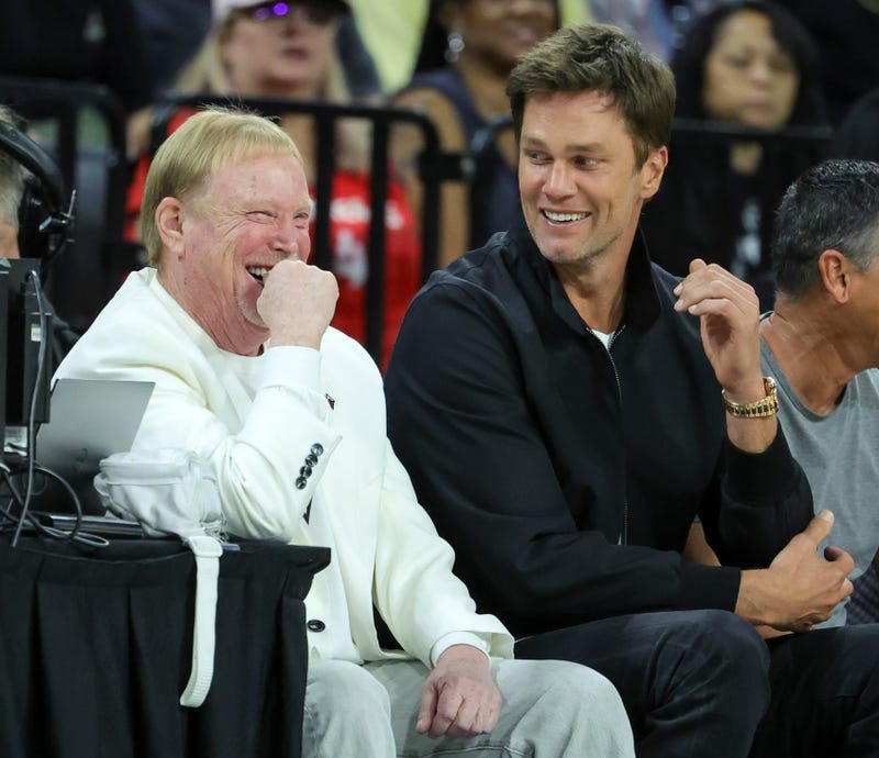 Las Vegas Raiders owner and managing general partner and Las Vegas Aces owner Mark Davis (L) and Tom Brady laugh as they attend Game One of the 2023 WNBA Playoffs.