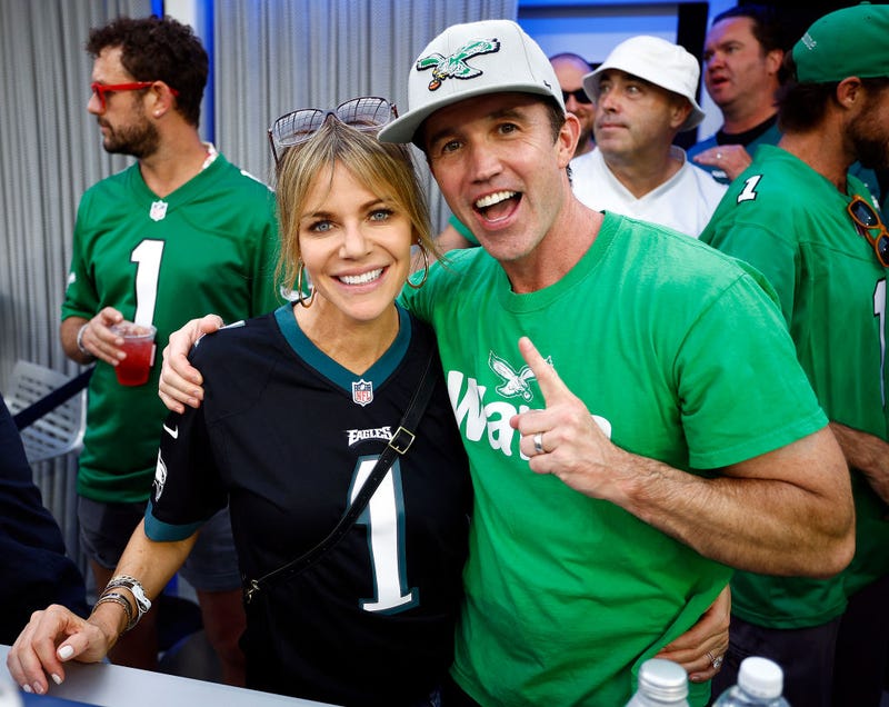 Actors Kaitlin Olson and Rob McElhenney pose for photos during the game between the Philadelphia Eagles and the Los Angeles Rams at SoFi Stadium on October 08, 2023 in Inglewood, California. (Photo by Ronald Martinez/Getty Images)