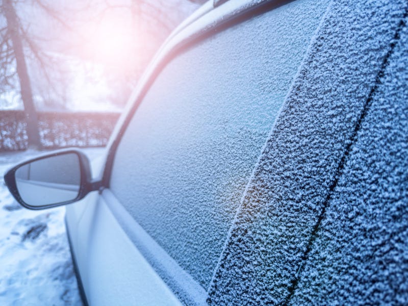 Light dusting of snow on a car's windows