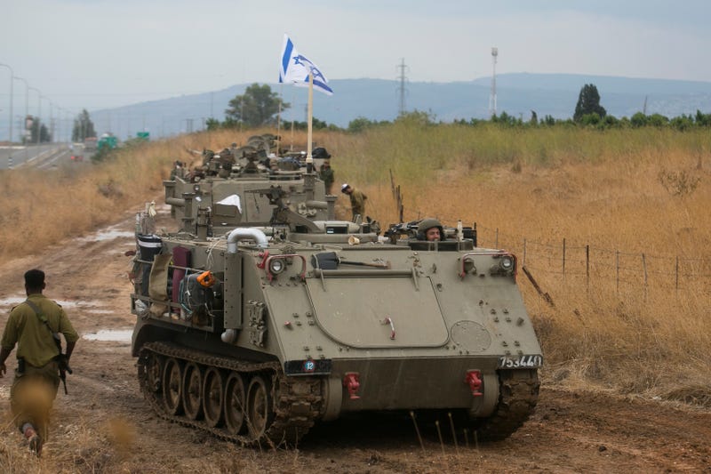  Israeli armor personnel carriers move in formation near the Israeli border with Lebanon on October 15, 2023 Near Amiad , Israel. 