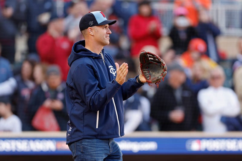 Former Minnesota Twins player Joe Mauer prepares to catch the ceremonial first pitch before Game Three of the Division Series between the Houston Astros and the Minnesota Twins at Target Field on October 10, 2023 in Minneapolis, Minnesota.