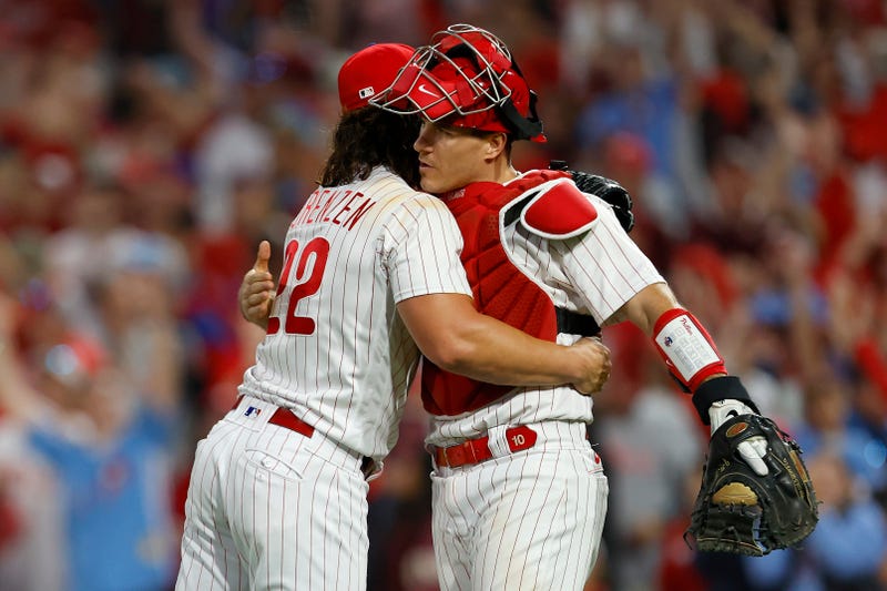 Michael Lorenzen and J.T. Realmuto of the Philadelphia Phillies celebrate after defeating the Atlanta Braves in Game Three of the Division Series at Citizens Bank Park on Wednesday night.