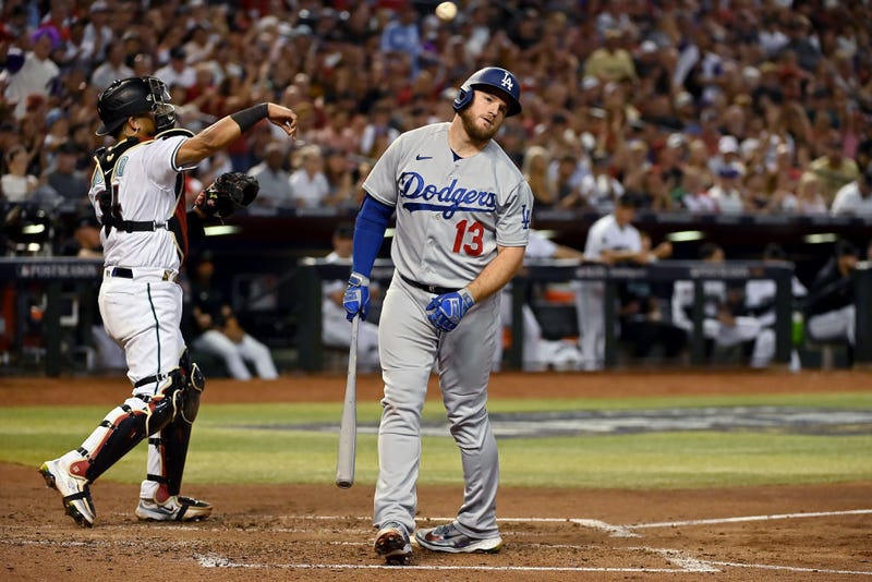 Max Muncy #13 of the Los Angeles Dodgers reacts after striking out in the fifth inning against the Arizona Diamondbacks during Game Three of the Division Series at Chase Field on October 11, 2023 in Phoenix, Arizona. 