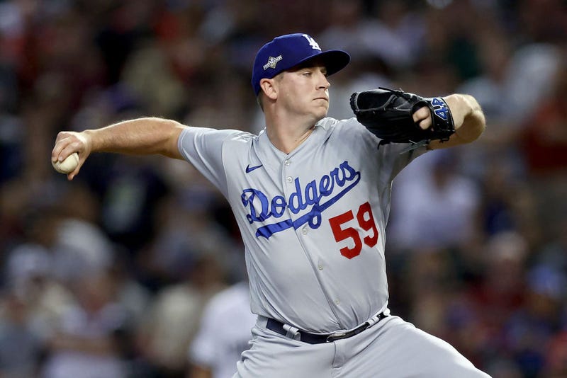 Evan Phillips #59 of the Los Angeles Dodgers pitches in the eighth inning against the Arizona Diamondbacks during Game Three of the Division Series at Chase Field on October 11, 2023 in Phoenix, Arizona.