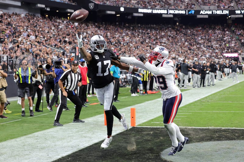 Davante Adams #17 of the Las Vegas Raiders attempts to catch a pass while defended by J.C. Jackson #29 of the New England Patriots during the fourth quarter at Allegiant Stadium on October 15, 2023 in Las Vegas, Nevada.