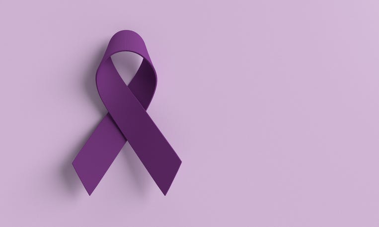 purple ribbon on lavender background for cancer awareness
