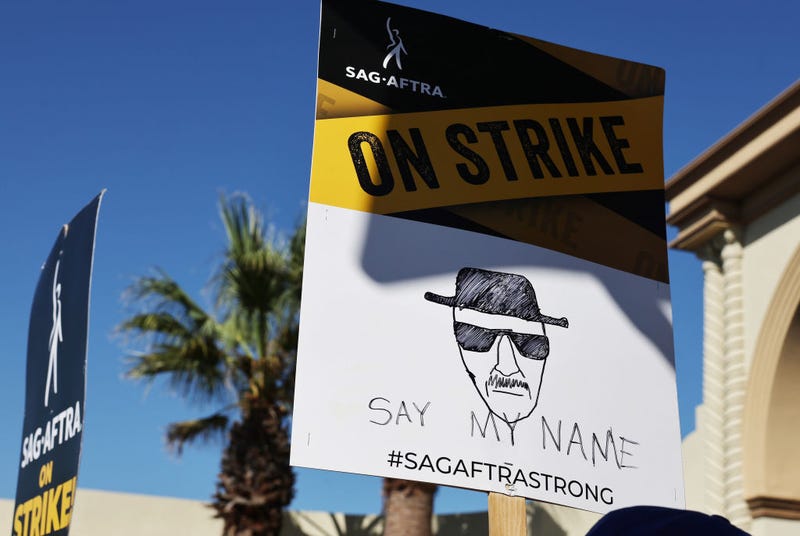 People carry signs as striking SAG-AFTRA members and supporters picket outside Paramount Studios on day 95 of their strike against the Hollywood studios on October 16, 2023 in Los Angeles, California. 