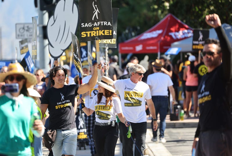 Striking SAG-AFTRA members and supporters picket outside Disney Studios on day 95 of their strike against the Hollywood studios on October 16, 2023 in Burbank, California. Contract negotiations between the actors union and the Alliance of Motion Picture and Television Producers (AMPTP) broke down last week in the strike which began July 14. (Photo by Mario Tama/Getty Images)