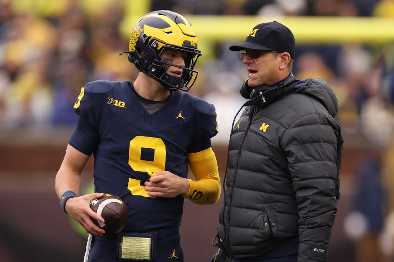 Michigan football coach Jim Harbaugh and QB JJ McCartyh
