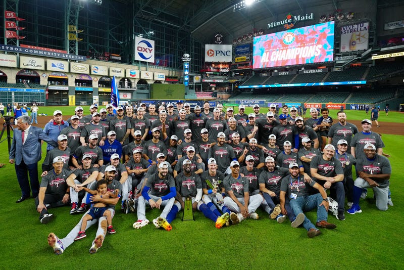 Members of the Texas Rangers pose for a photo after Game 7 of the ALCS