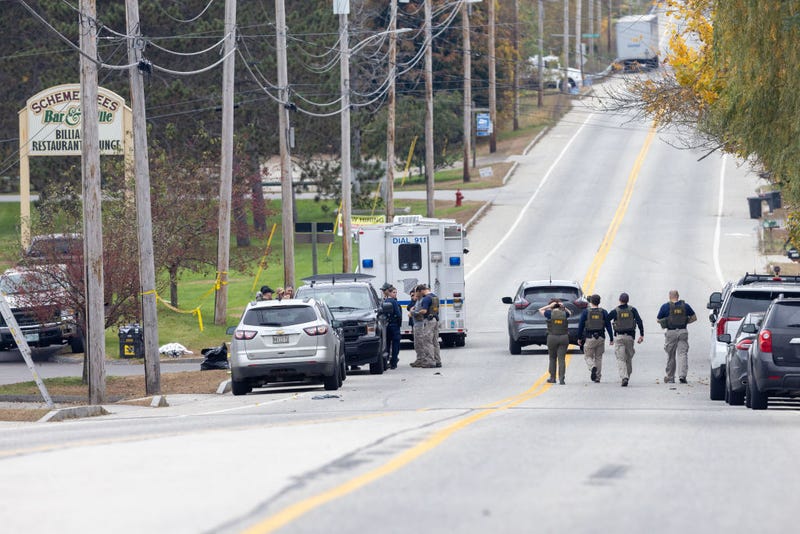 Members of the FBI Evidence Response Team gather at the site of a mass shooting at Schemengees Bar and Grille on October 26, 2023 in Lewiston, Maine. 