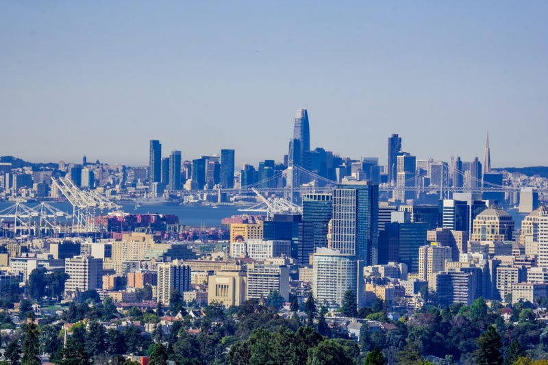 Oakland Downtown skyline with San Francisco skyline in the background
