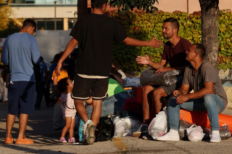 Migrants from Texas rest