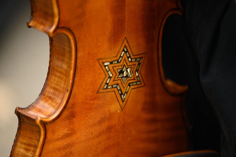 A Star of David adorns a violin that is part of the Violins of Hope, instruments played by Jewish musicians during the Holocaust, which were played during the Commemoration Ceremony on the fifth anniversary of the Tree of Life synagogue attack on October 27, 2023 in Pittsburgh, Pennsylvania.