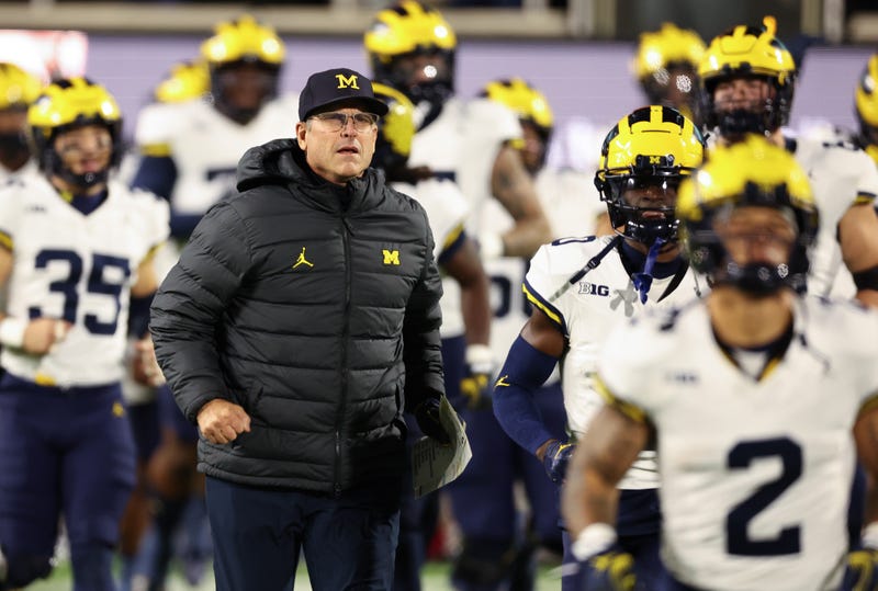 Jim Harbaugh and Michigan players