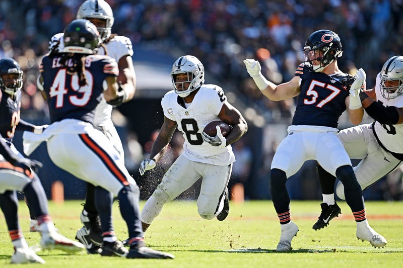 Josh Jacobs #8 of the Las Vegas Raiders runs with the ball during the second quarter against the Chicago Bears at Soldier Field on October 22, 2023 in Chicago, Illinois.