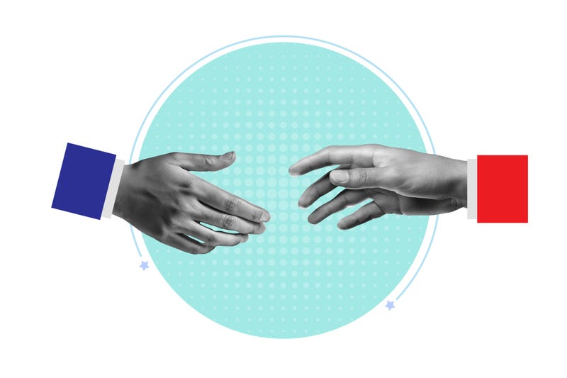 hand with blue sleeve and hand with red sleeve reaching to touch