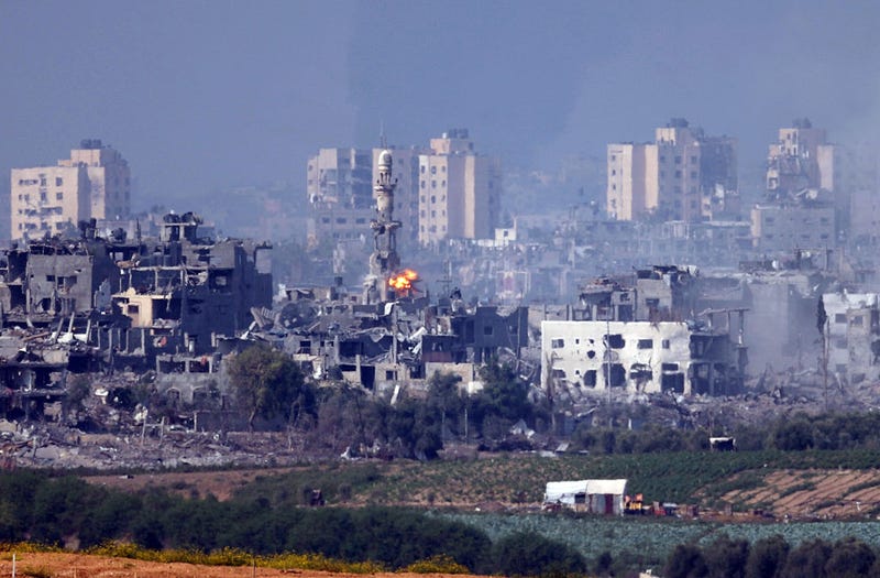 A missile strikes behind a minaret in Gaza on October 28, 2023 seen from Sderot, Israel. In the wake of the Oct. 7 attacks by Hamas that left 1,400 dead and 200 kidnapped, Israel launched a sustained bombardment of the Gaza Strip and threatened a ground invasion to vanquish the militant group that governs the Palestinian territory. But the fate of the hostages, Israelis and foreign nationals who are being held by Hamas in Gaza, as well as international pressure over the humanitarian situation in Gaza, have complicated Israel's military response to the attacks. A timeline for a proposed ground invasion remains unclear. (Photo by Dan Kitwood/Getty Images)