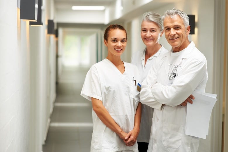 Smiling medical workers in hospital