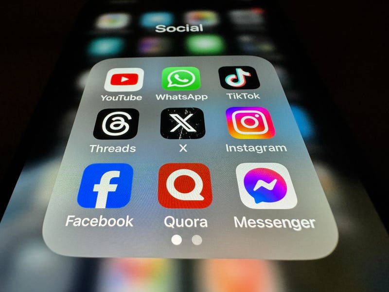 In this photo illustration the logo of US online social media and social networking site 'X' (formerly known as Twitter) is displayed centrally on a smartphone screen alongside that of Threads (L) and Instagram (R) on October 29, 2023 in Bath, England. On the top row the logo of online video sharing and social media platform YouTube is seen alongside that of Whatsapp and TikTok. Along the bottom row Facebook, Quora amd Messenger are displayed. It has been over a year since Elon Musk controversially bought the company in which he made lots of redundancies and also rebranded Twitter to the the letter 'X'