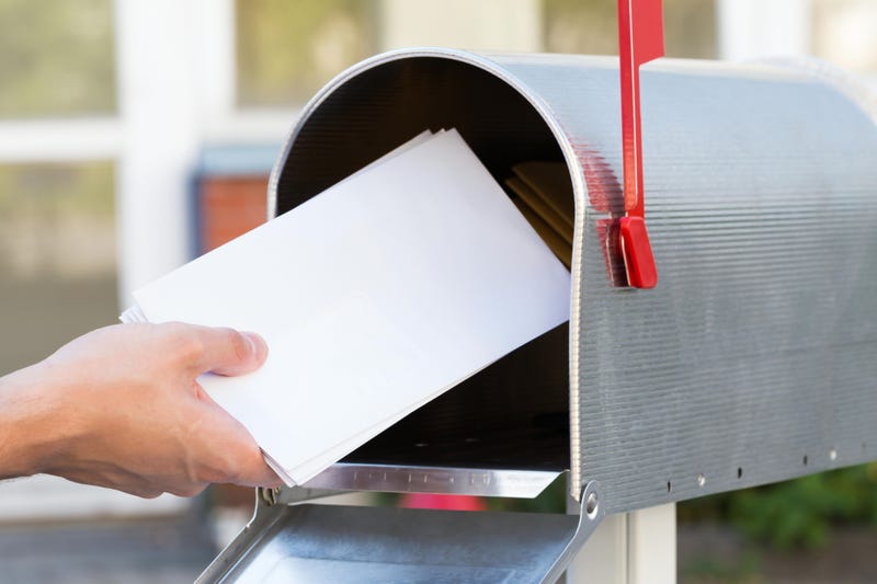 person grabbing mail